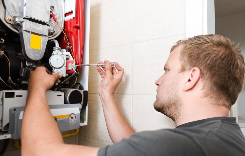 technician_repairing_gas_furnace